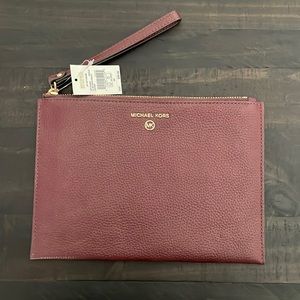 Michael Kors XL zip clutch wristlet. Leather, color Merlot